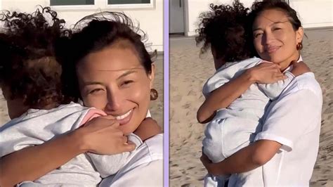 jeannie mai beach|Jeannie Mai Snuggles Up to Daughter Monaco at the Beach。